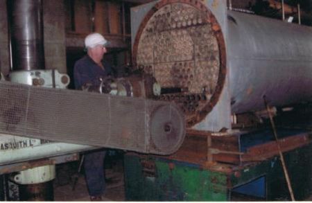 Bill drilling out the steel pipes out of a big condenser so we can sell the 50mm pipes for the likes of cattle yards. 