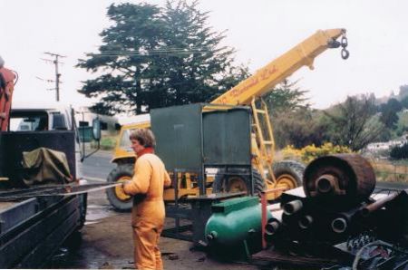 Tom unloading the work truck, Chris's nicely painted Hamilton crane in the background.