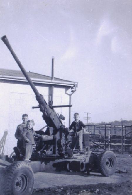 Bill with his oldest two children, Michael and Christine playing on some of the great toys in the yard. 