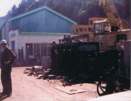 Bill on the left and Tom on the right stripping down an old machine, 1982